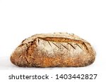 Small photo of Loafs (or miche) of French sourdough, called as well as Pain de campagne, on display isolated on a white background. Pain de Campagne is a typical French huge loaf of bread abiding by traditional code