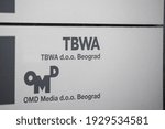 Small photo of BELGRADE, SERBIA - JANUARY 30, 2021: Selective blur on TBWA Worldwide logo on their office for Belgrade. TBWA is a American communications, marketing, advertisement, public relations marketing agency