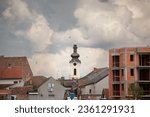 Panorama of Sremska Mitrovica city center, Serbia with chaotic urbanism houses on construction  clocktower steeple of Crkva Svetog Dimitrije orthodox church with austro hungarian baroque architecture