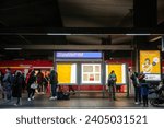 Small photo of DORTMUND, GERMANY - NOVEMBER 13, 2022: People waiting for trains in front sign indicating Dusseldorf Hbf, or Dusseldorf Hauptbahnhof, Dusseldorf Main train station, the main railway hub of the city.