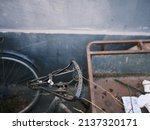 Small photo of A bicycle dumped in a hutong, old and traditional alley of Beijing, China. It makes us feel lonely.