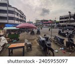 Small photo of Lubuklinggau, Indonesia - December 16, 2023: The Inpres Lubuklinggau market is a hive of activity as sellers and buyers haggle over prices and make purchases