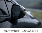Black car rearview mirror close-up