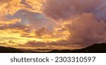 Small photo of aerial view Bright golden yellow clouds dazzle the sky at sunrise. Bright red-orange sky, beautiful beyond imagination. drone shooting stunning sky full of colorful cloud. abstract nature background.