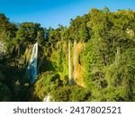 Small photo of Aerial View Numerous waterfalls flow from wide, steep cliffs. Thi Lor Su waterfall Nestled amidst the untouched beauty of Tak Province. Thi Lo Su Waterfall The Largest Waterfall in Thailand.