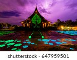 Small photo of The lightning behind the temple as the rain began to fall in the evening.thunderclap make sky in purple color. Sirindhorn Wararam Phu Prao temple is in Ubon Ratchathani east of Thailand