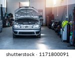 Vehicle repair shop with car and tools. Car service.