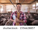 Portrait of happy farmer with...