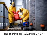 Chemical worker carrying...