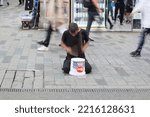 Small photo of Istanbul Turkey, September 25 2022. A busker playing drum using bucket in the street
