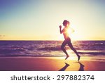 Woman Running On The Beach At...