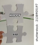 Small photo of Reflection of jigsaw puzzle with example of opposite word antonym concept