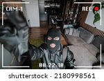 Small photo of Being Caught. Robber entering house, holding crowbar and looking at CCTV camera, high angle view from above. The robber noticed a security camera.