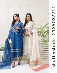 Small photo of Female Models wearing ethnic party wear traditional attire Indian and Pakistani Fashion on vintage clean white victorian background Taken at Karachi, Sindh, Pakistan Date April 11th 2021