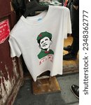 Small photo of Shanghai, Jiangsu, China - November 17 2017: President Barack Obama satirical print shirt known as Oba Mao (Oba-mao) is still in fashion and displayed in the streets of Shanghai tourist area.