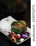 Small photo of tradtional cambodian amok fish curry meal on siem reap restaurant table