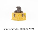 Toy mouse in cheese isolated on ...