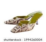Elegant sandals made of beige crocodile leather, with medium-high heels, isolated on a white background. High quality photo.