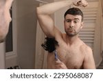 Man with an extremely hairy armpit 