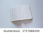 open blank notebook on a white... | Shutterstock . vector #1717686244
