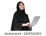 Arab abaya woman using laptop. Arabian muslim businesswoman working.
