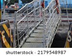 Small photo of gangway ladder with safety net installed as an accommodation bridge between the ship and the port
