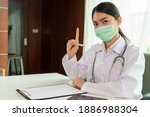 doctor in uniform working on... | Shutterstock . vector #1886988304
