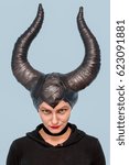 Small photo of Maleficent - beautiful woman from a fairy tale with hair horns