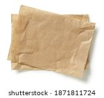 crumpled brown baking paper sheets isolated on white background, top view