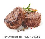 grilled beef steaks with spices isolated on white background