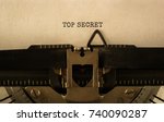 Small photo of Text TOP SECRET typed on retro typewriter