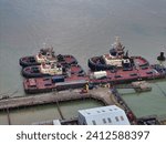 Small photo of Svitzer Tugs, Sheerness, Kent, UK - 14 Jan 2024 from left clockwise Svitzer Ramsey, Ganges and Monarch awaiting their next job in Sheerness