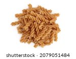 Wolegrain fusilli pasta from durum wheat isolated on white background with clipping path and full depth of field. Top view. Flat lay.