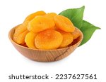 Dried apricots in wooden bowl isolated on white background and full depth of field.