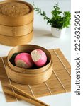 Small photo of Pink steamed bun. The traditional chinese steamed cake " Mi ku" is an importat cake during praying ceremonies as offerings to Chinese Gods. Selective focus.