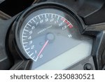 close up of the speedometer on a motorcycle