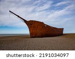 hull of an old ship burned on the seashore. The ship was called Marjorie Glen and it is in Punta Loyola
