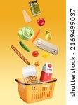Small photo of Yellow shopping basket with fresh food full of variety of grocery products, food and drink on yellow background. Supermarket food concept. Home delivery. Food ingredient float. Flying concept.