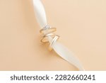 Small photo of Wedding ring photography is an important part of a wedding photoshoot, capturing the elegance and significance of a couple's love and commitment. These close-up shots highlight the intricate details o