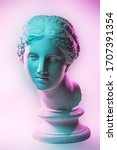 Small photo of Statue of Venus de Milo. Creative concept colorful neon image with ancient greek sculpture Venus or Aphrodite head. Webpunk, vaporwave and surreal art style. Pink and green duotone effects.