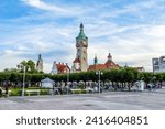 Small photo of Sopot, Poland - September 7 2022: Skwer Kuracyjny square - elegant spacious square with trees and benches on late summer evening. Sopot Lighthouse and Lutheran Zbawiciela Salvator church landmarks.