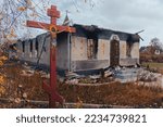 Small photo of Countryside. Damaged after the shelling of the Orthodox Church. Holes from bullets and shrapnel in the fence. War in Ukraine. Russian invasion of Ukraine. Terror of the civilian population