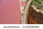 Aerial view of Hutt Lagoon Pink Lake in Western Australia. Separated by road, on one side boasts a pink hue lake and on the other is a regular irrigation dam.