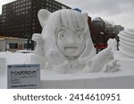 Small photo of Sapporo, Hokkaido, Japan - February 4th 2023: A snow sculpture centered around the character Anya Forger from the Spy x Family series