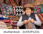 Peruvian Woman Weaving Baby...