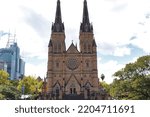 Small photo of Sydney, NSW, Australia - March 14, 2022: View of the cathedral church of the Roman Catholic Archdiocese of Sydney, St.mary's cathedral church with blue sky in Sydney.