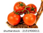 Red cherry tomatoes bunch closeup in white backgroud isolated with nobody extendable background shot using studio lighting and macro 100mm lens. 