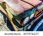 Rusty  Old  Junked Car In The...