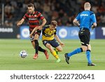 Small photo of SYDNEY,AUSTRALIA-NOVEMBER 5: Maximilien Balard of the Mariners competes for the ball with Milos Ninkovic of the Wanderers during the match between the Wanderers and the Mariners at CommBank Stadium