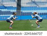 Small photo of Natalie Tobin and Remy Siemsen of Sydney FC warming up before the match between Sydney FC and Wanderers at Allianz Stadium on December 24, 2022 in Sydney, Australia